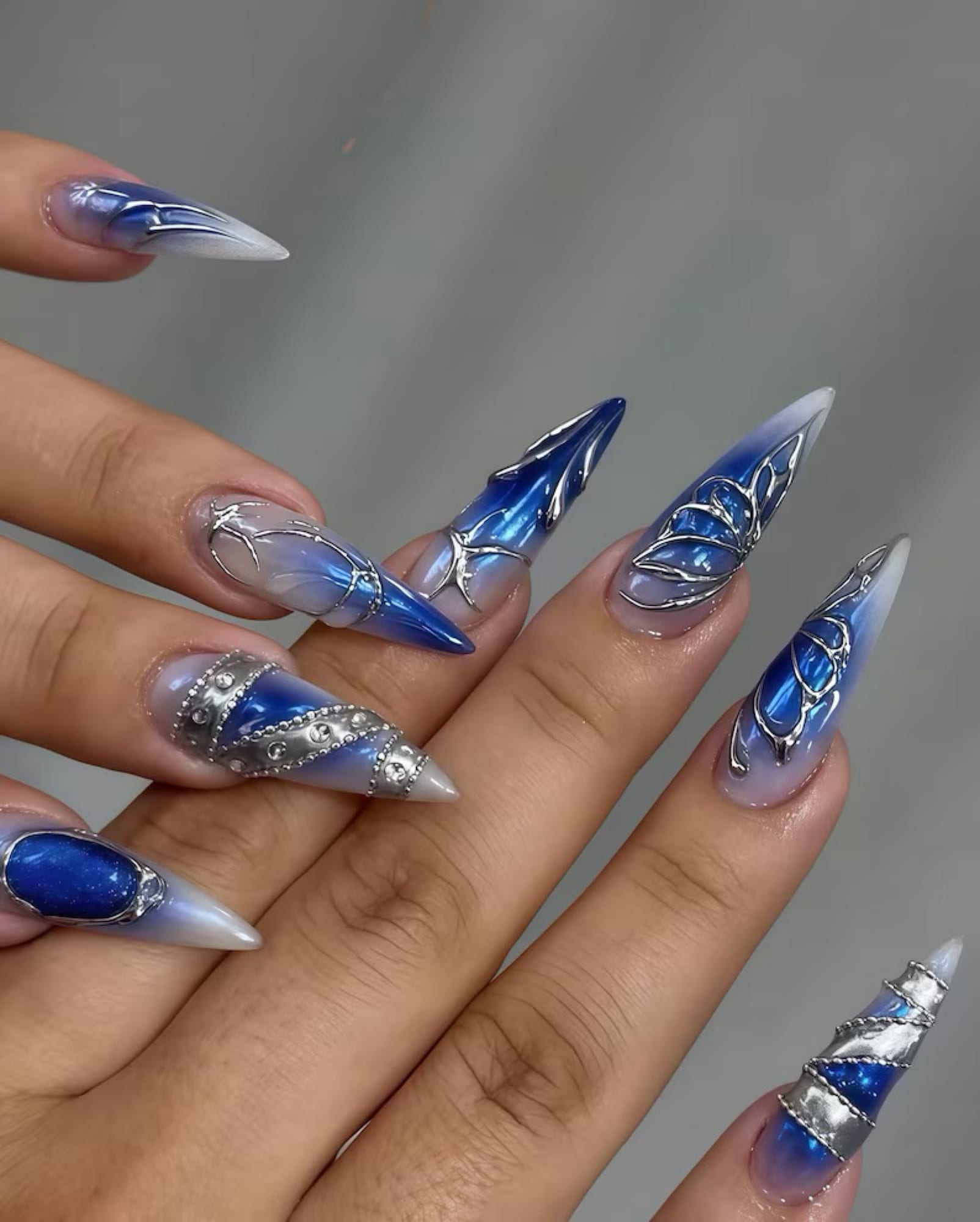 Blue and silver stiletto nail art