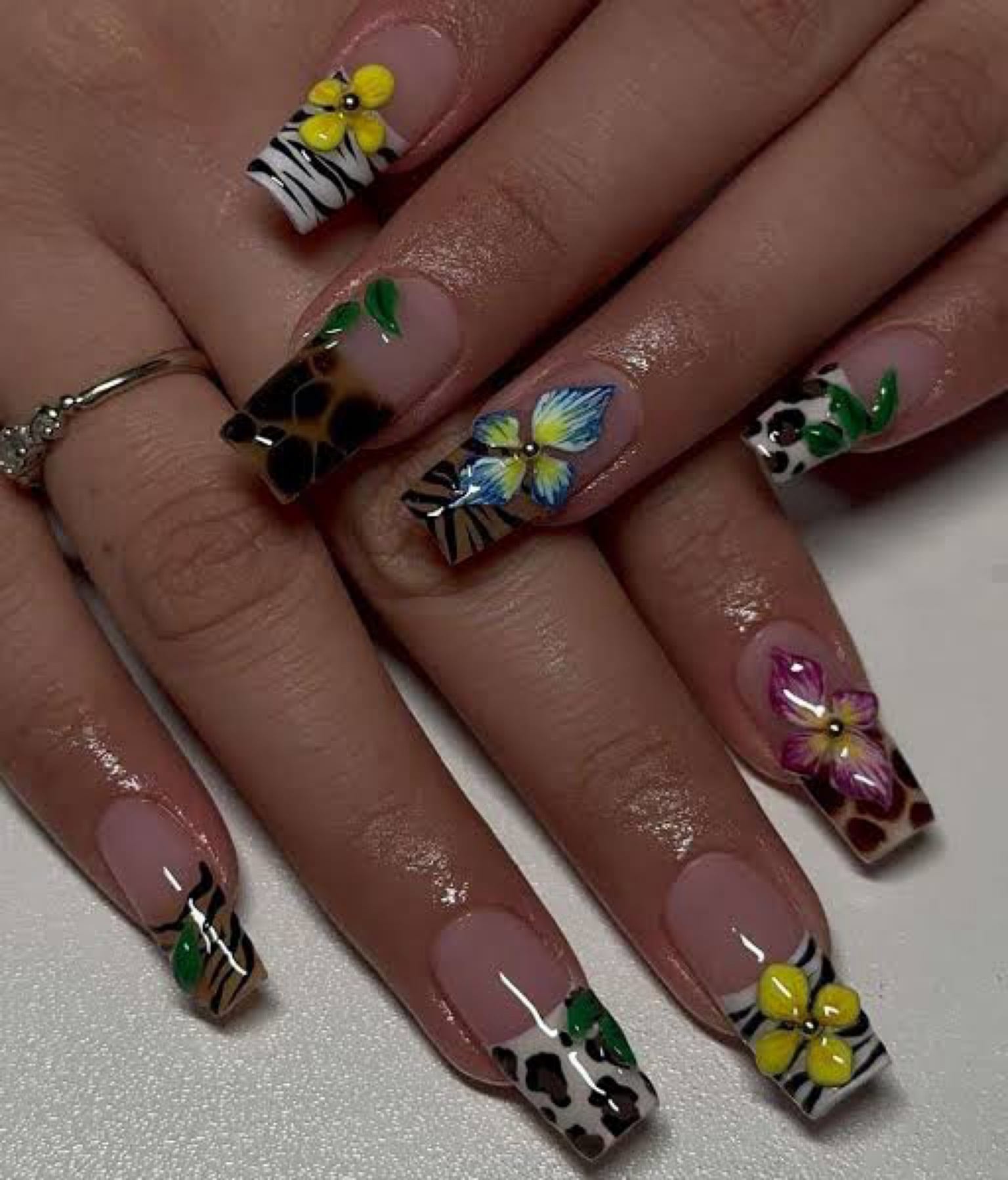 Hand-painted flowers and animal print nails